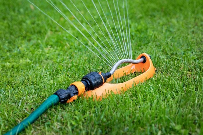 Efficient lawn watering with a modern sprinkler system.